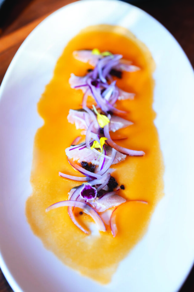 Scallop crudo with piquillo pepper vinaigrette. Photo: Nik House Media